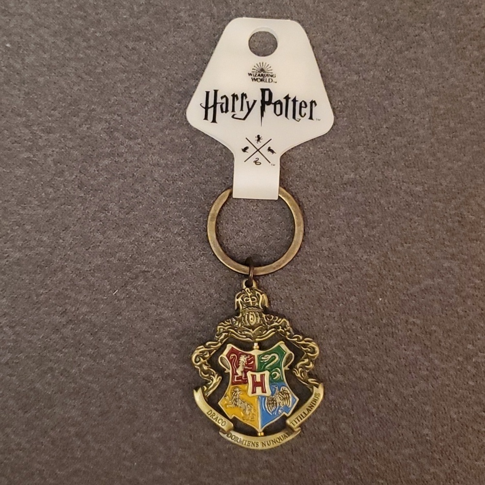 NWT Harry Potter metallic pivotal keychain. Four houses. From NYC store.